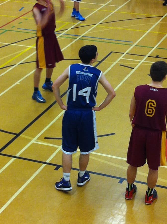 teenagers playing basketball