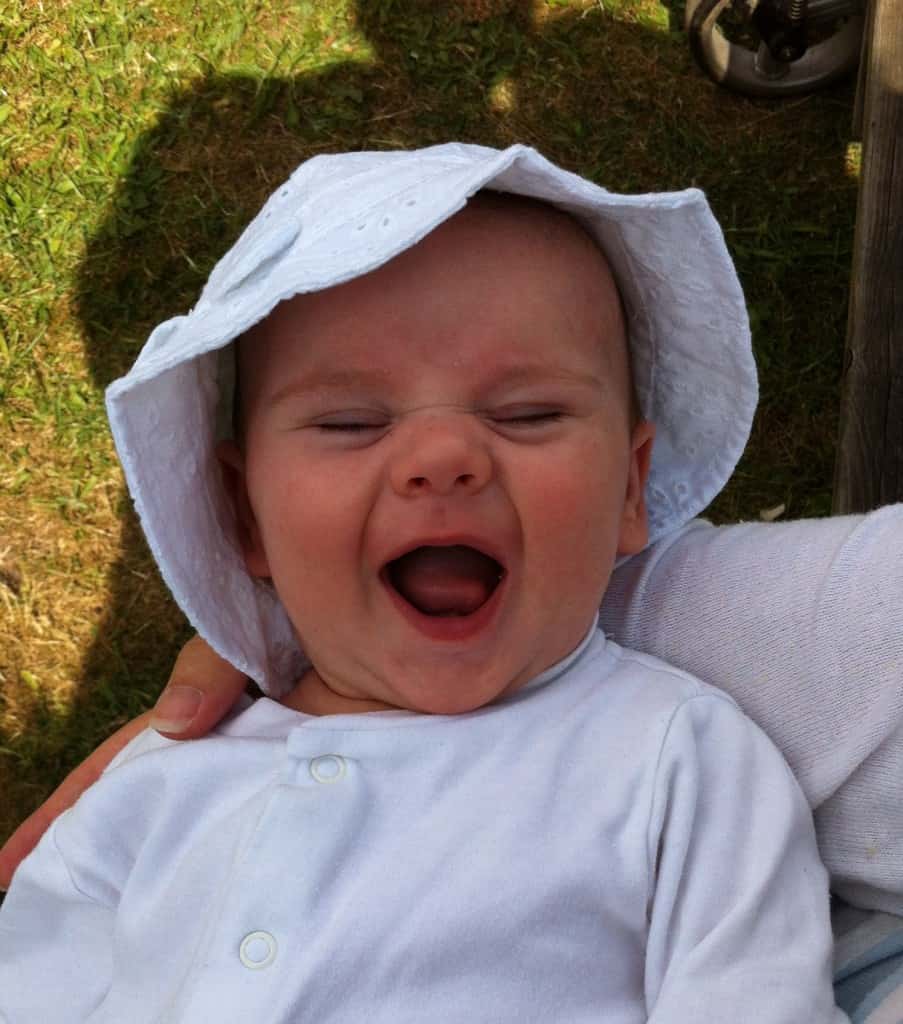 Happy Baby In sun hat 