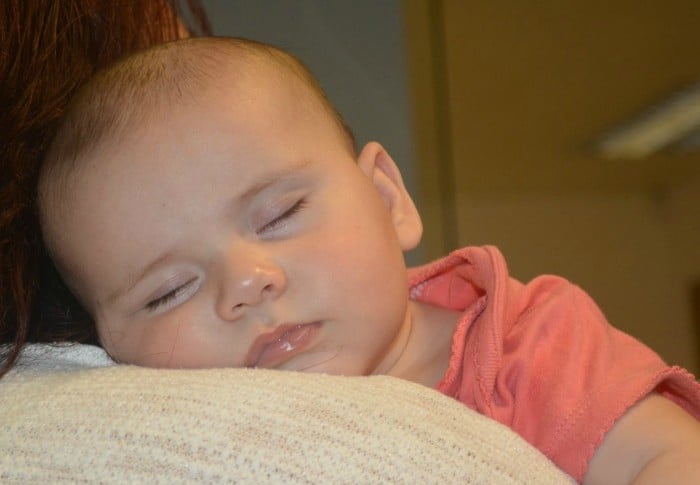 Baby sleeping on Mother's Shoulder