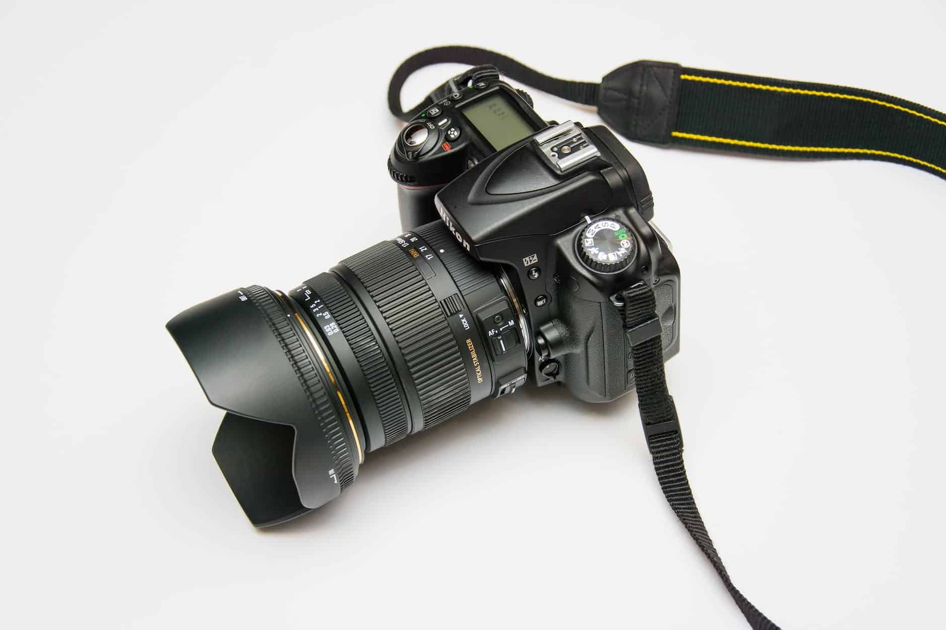 photo-camera-subject-photographer-51383 black dslr camera on white surface