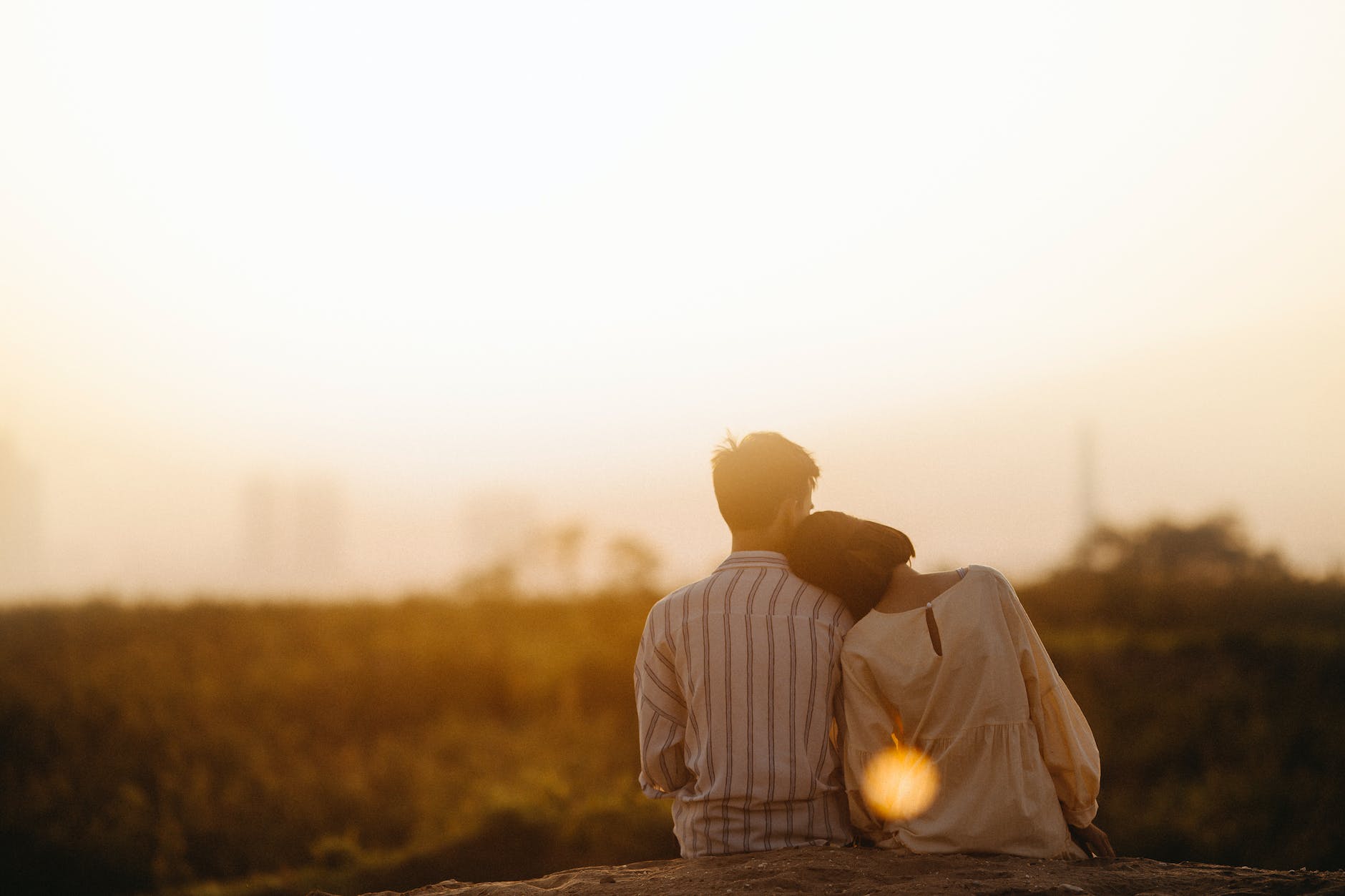 pexels-photo-1415131 man and woman near grass field