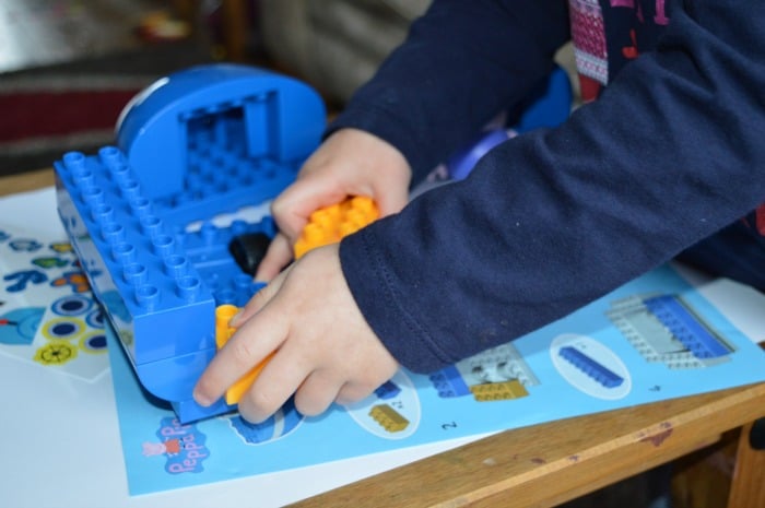 Girl Building peppa pig boat