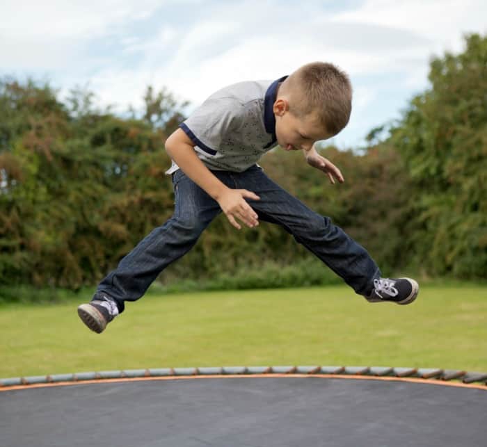 child on trampoline