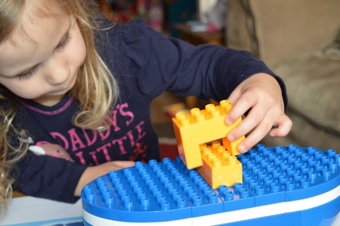 girl making boat