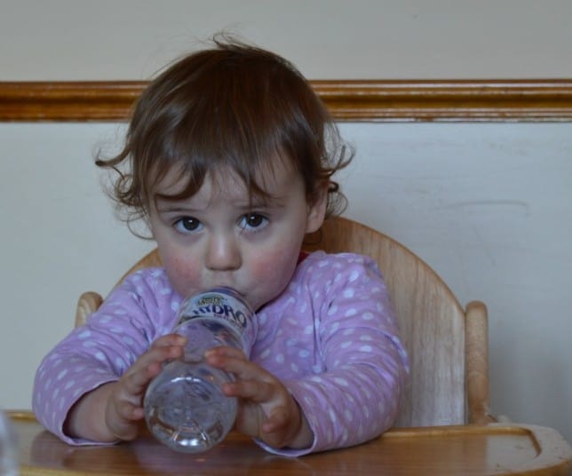 toddler drinking from bottle