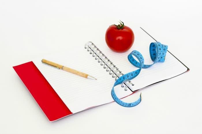 weight loss notebook tape and pen