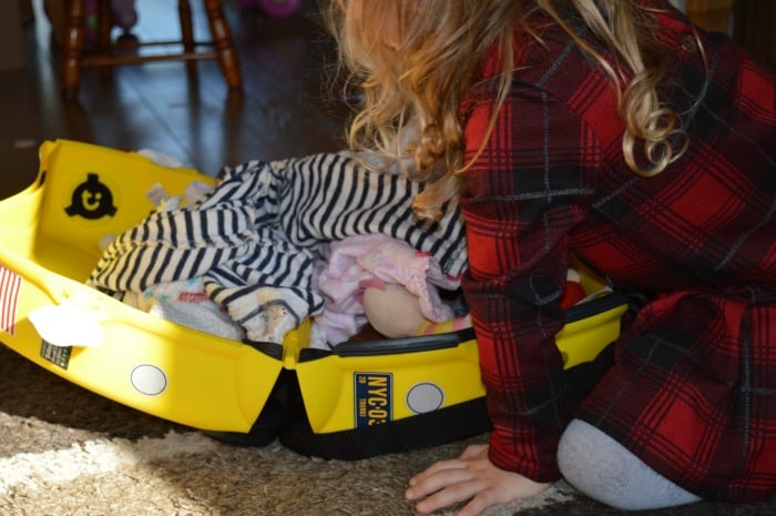 child packing suitcase
