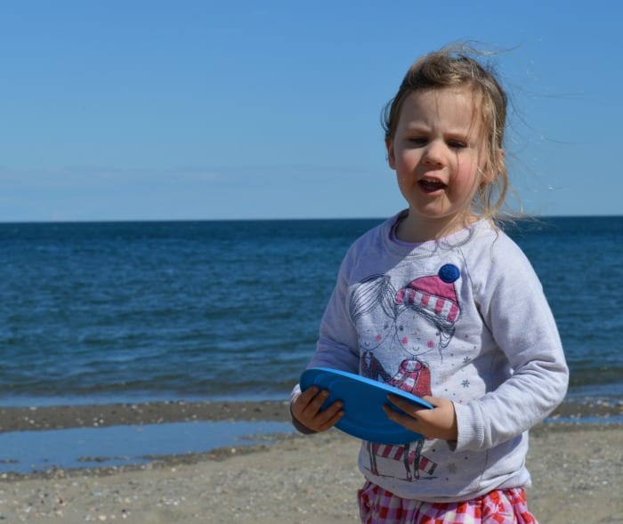 child playing frisbee