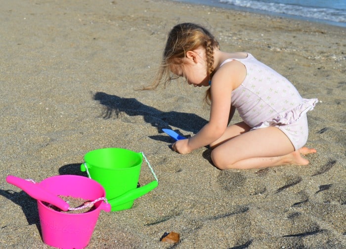 playing with bucket and spade on the beach