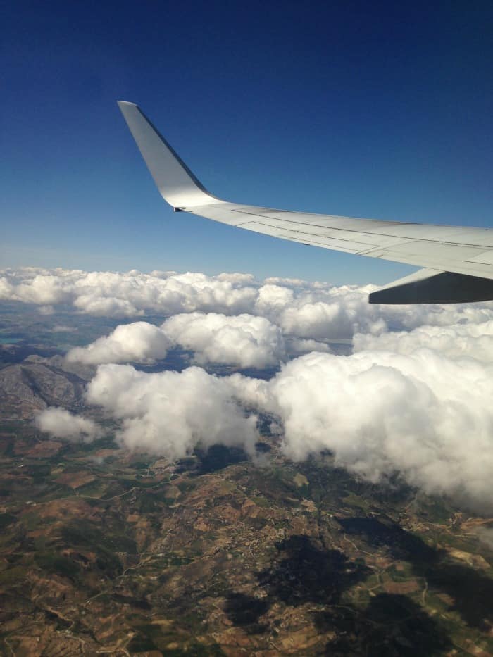 view from airplane of clouds and mountains spain