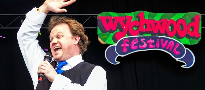 Justin-Fletcher on stage at WYCHWOOD FESTival