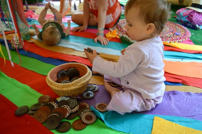 baby playing with buttons