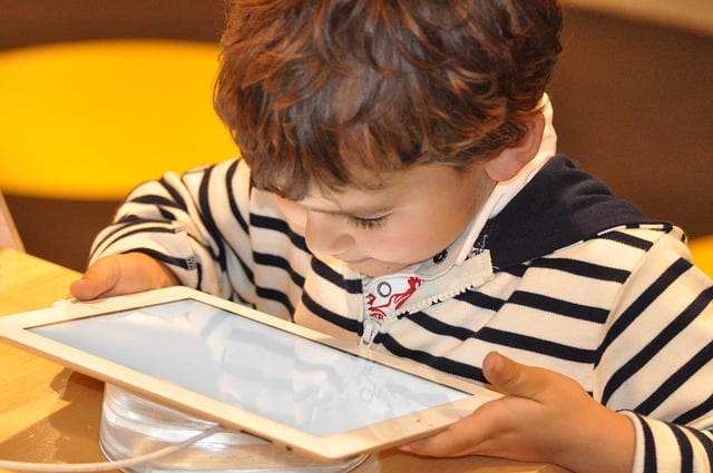 child looking at tablet computer