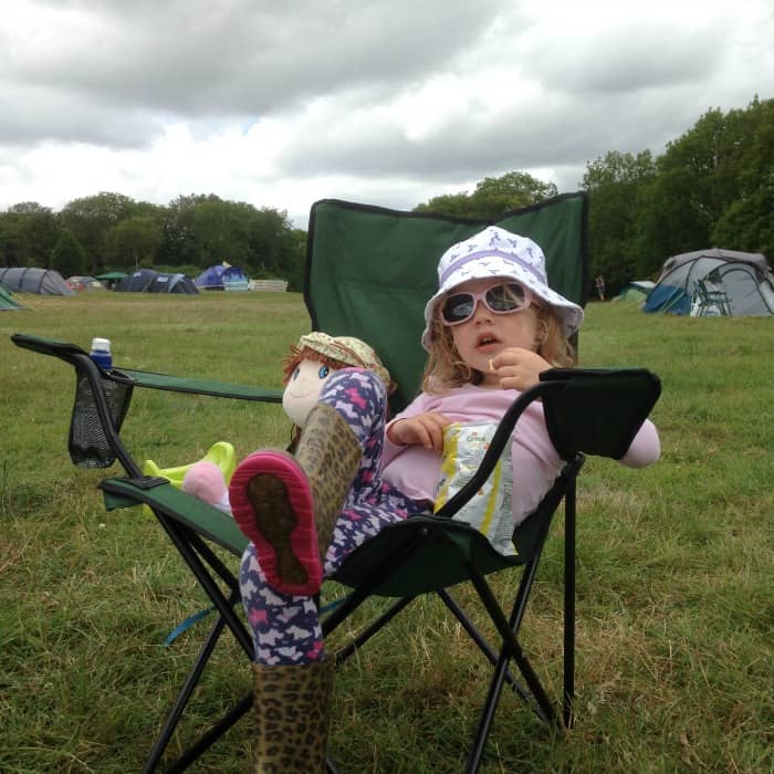 little girl on camping chair at festival
