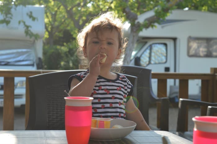 child eating outside