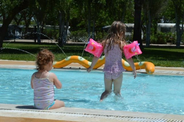 girls playing in a paddling pool