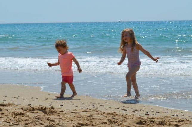 sisters playing in the sea