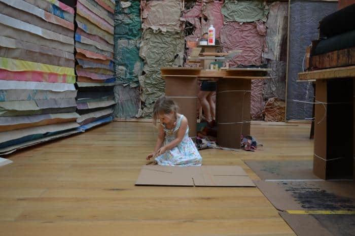 child drawing in art exhibition