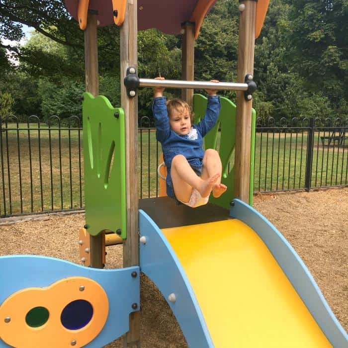 child playing on a slide