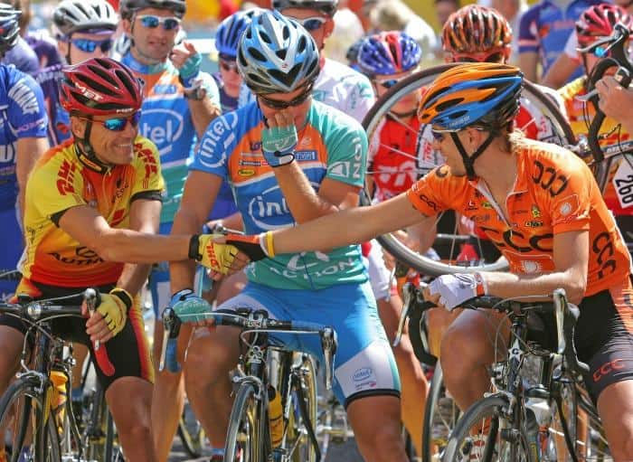 cyclists shaking hands