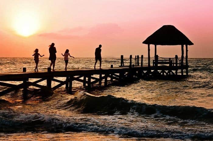 family-walking-along-pier