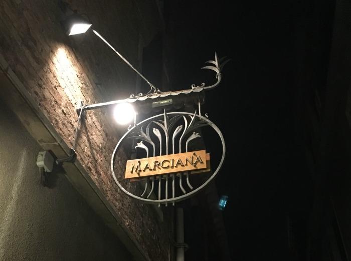 Marciana restaurant sign at night 