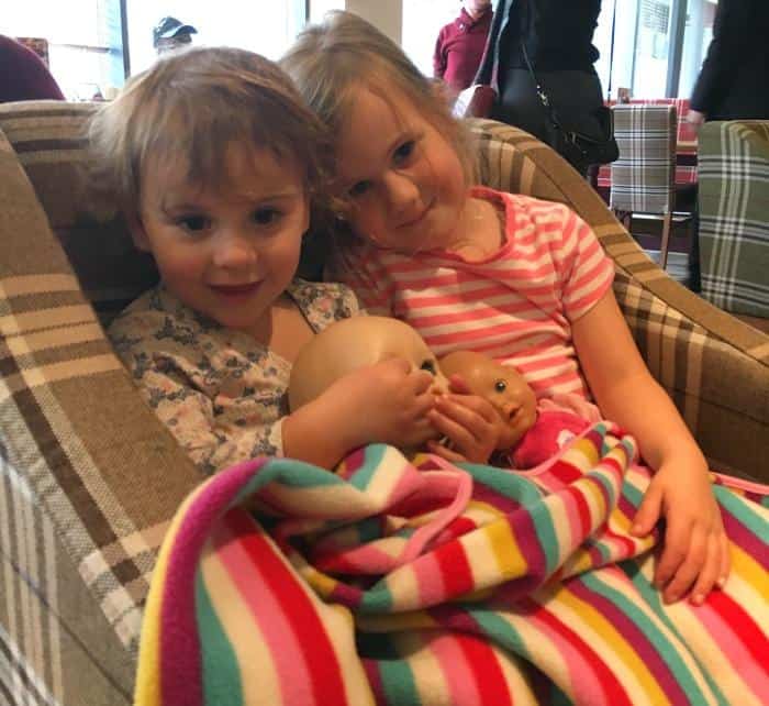 children-sitting-with-baby-dolls-in-hotel-premier-inn