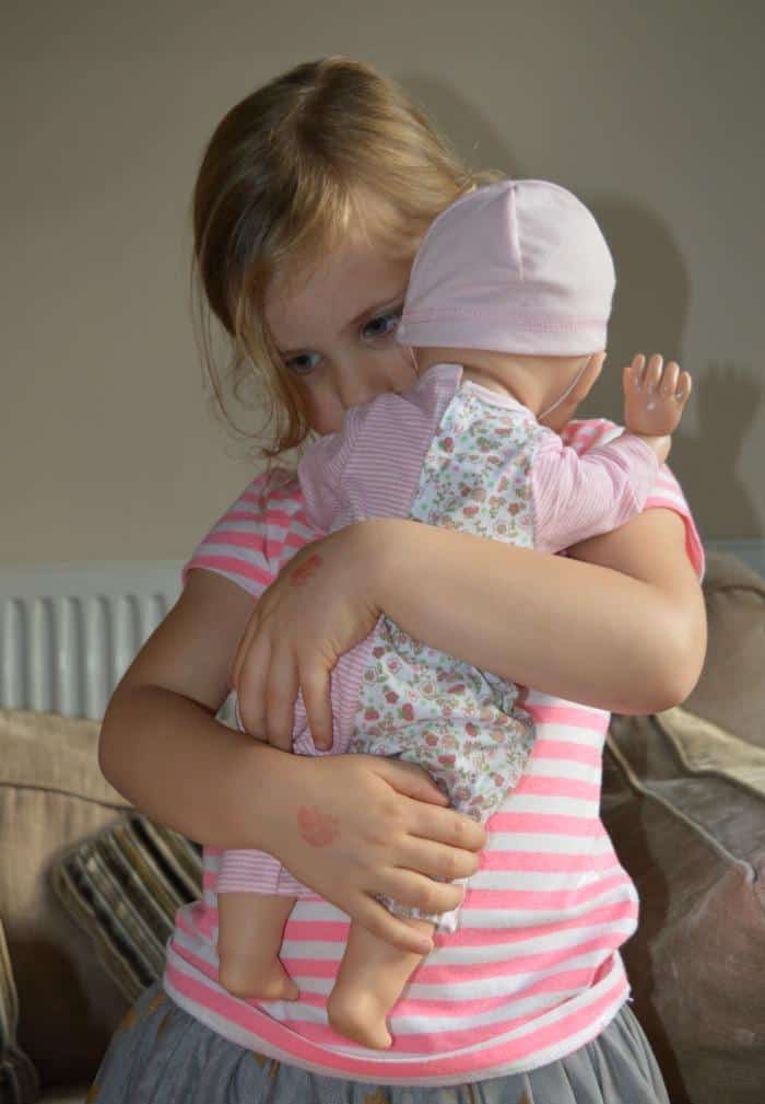 girl-holding-baby-annabell