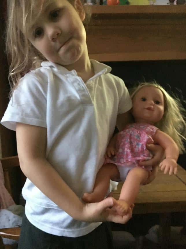 child-carrying-doll