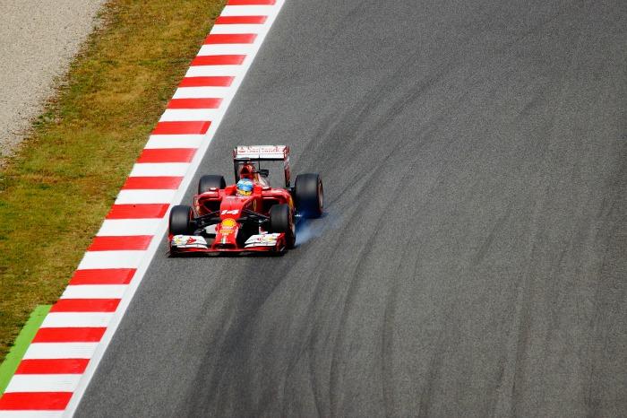 red racing car on track 