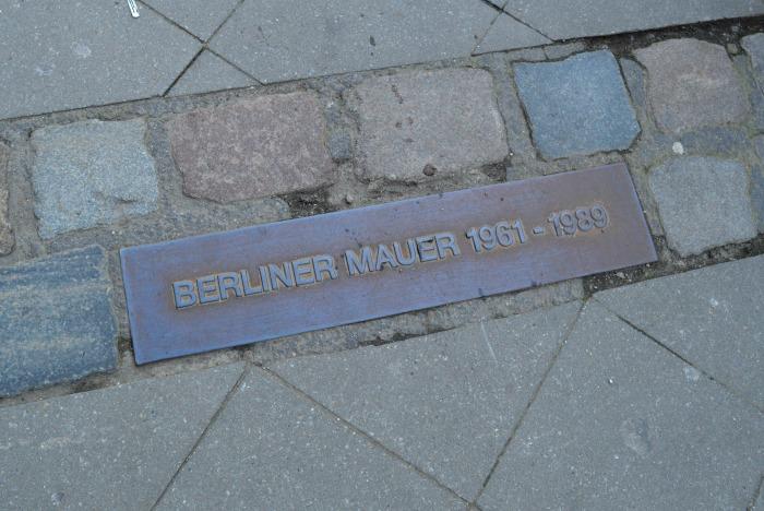 Berlin Wall Plaque with dates on pavement