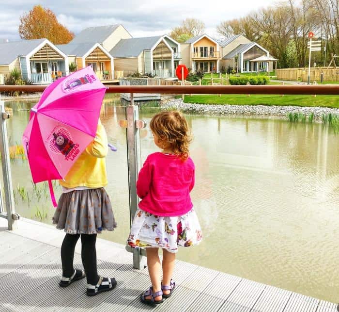 children looking at lake from decking 