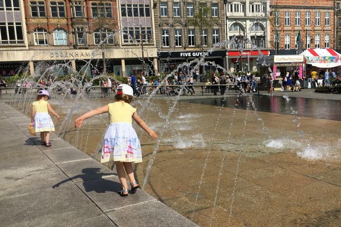 children playing in the fountains Market Square Nottingham