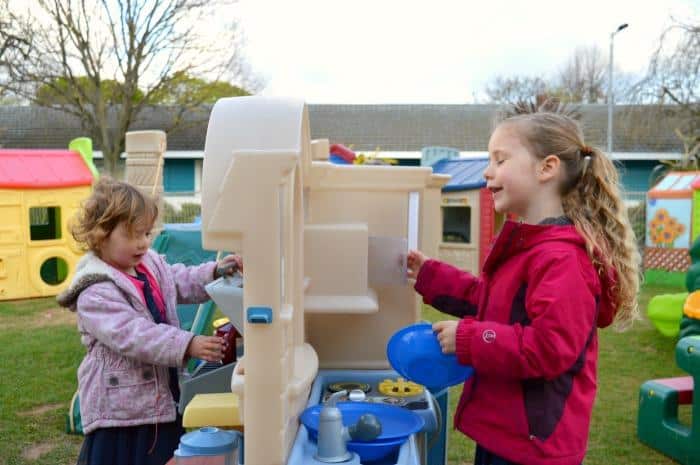 kids playing in Little tikes kitchen