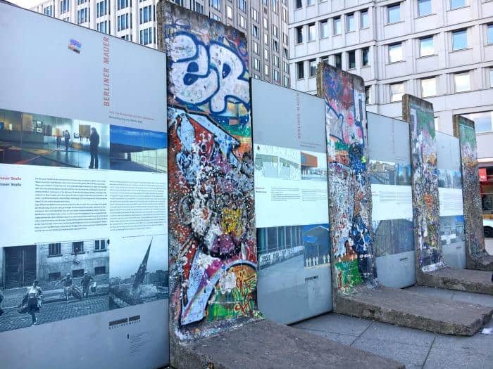 sections of Berlin Wall covered in graffiti