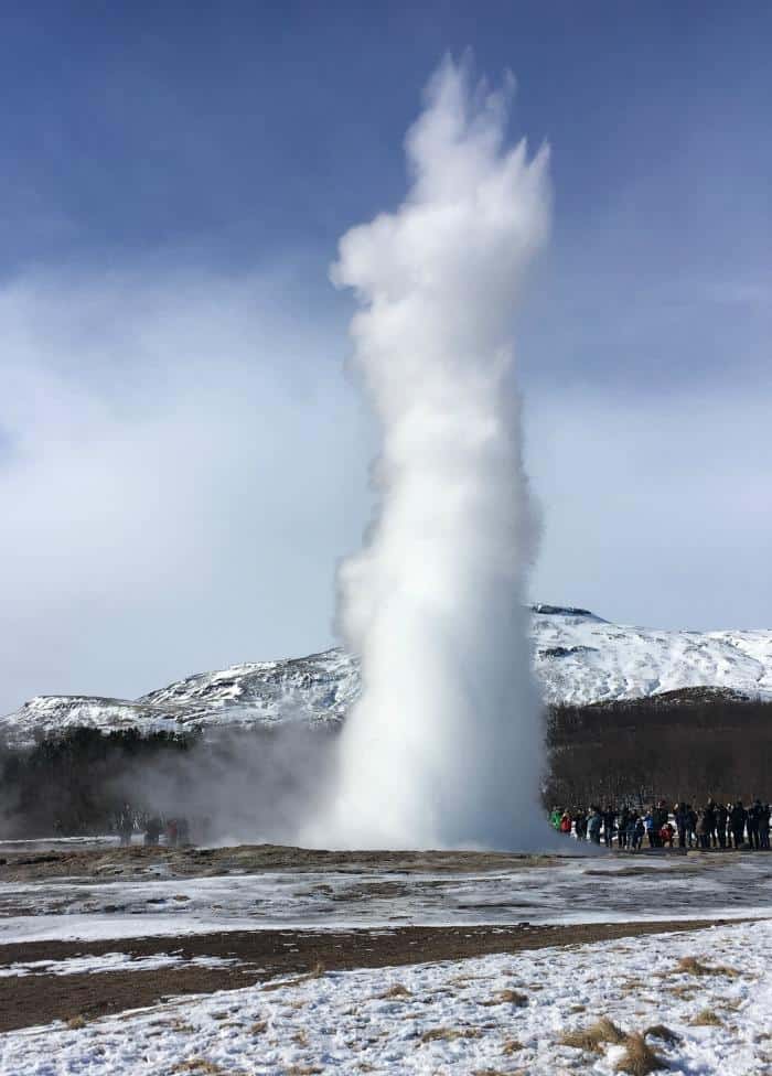 stokkur erupting steam into air 