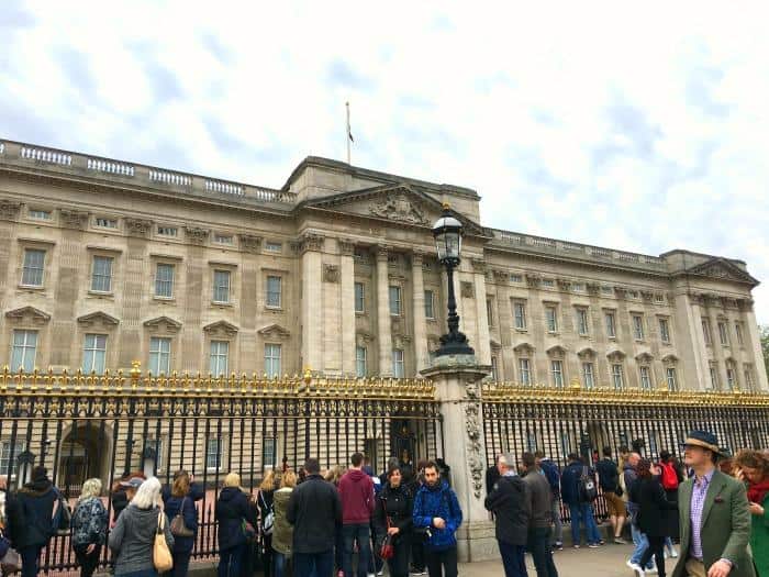 Buckingham Palace including gates and visiting tourists 