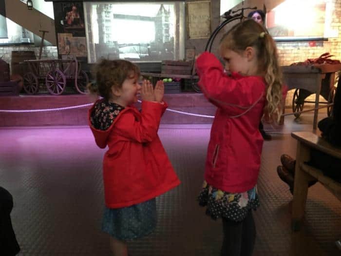 Children showing action of Tower Bridge