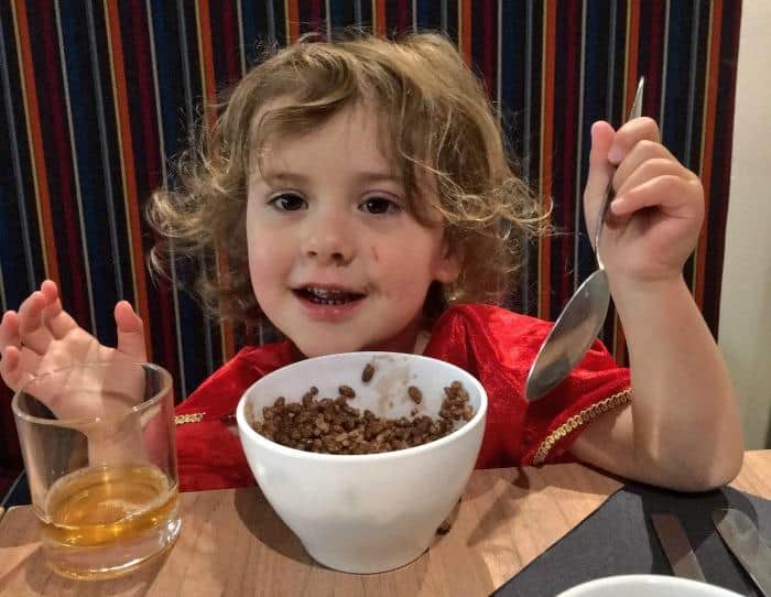 child eating cereal