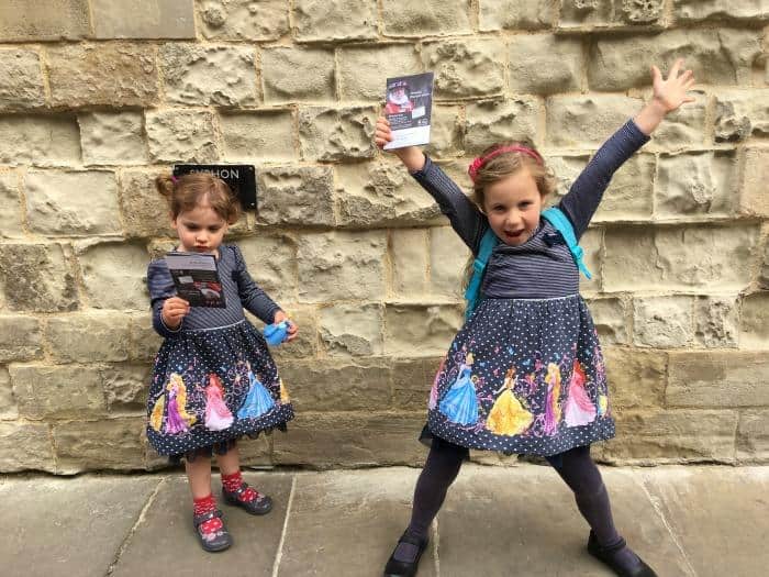 two girls stood by a wall at Tower of London