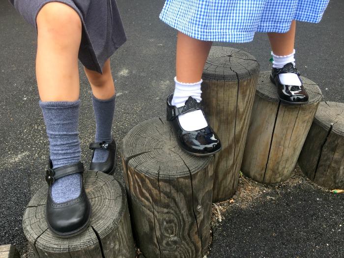 Girls wearing new school shoes