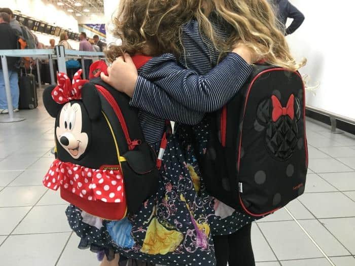 girls wearing disney minnie mouse bags