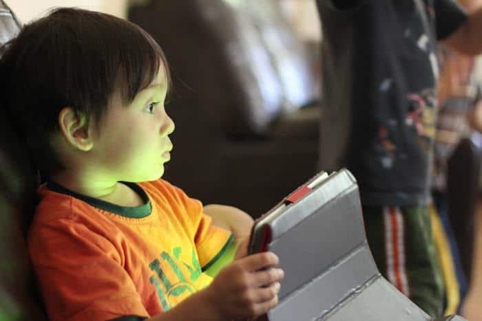 kid watching tablet