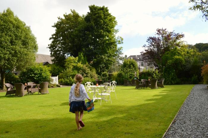 child exploring Bedford hotel garden tavistock Devon England UK