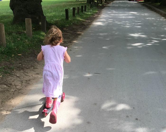 child on scooter