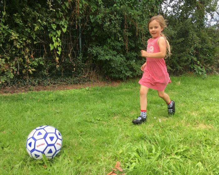 girl playing football