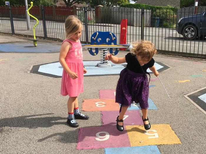 kids playing hopscotch