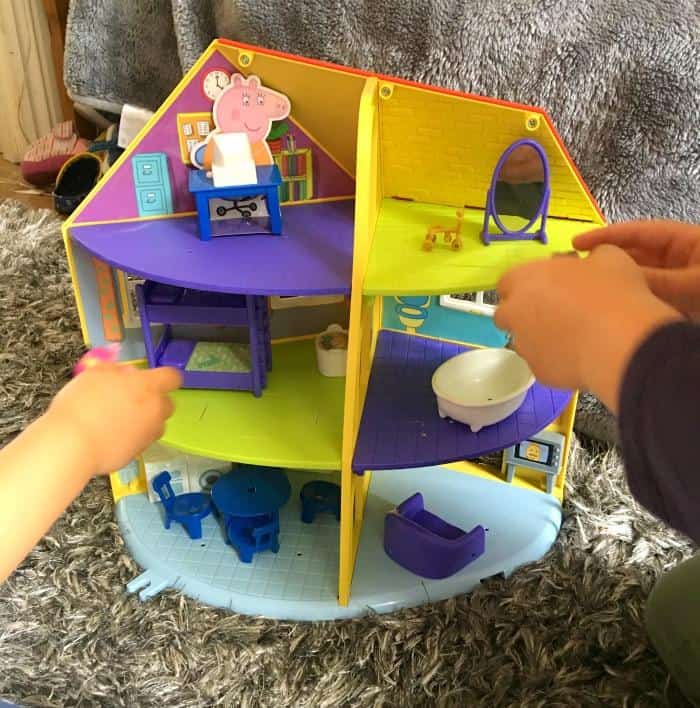 playing with peppa pig house