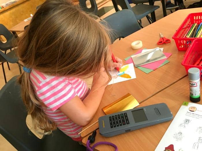 child taking part in craft activity at The Roman Baths 