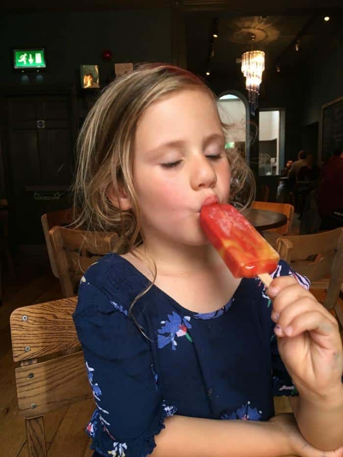 girl eating ice lolly